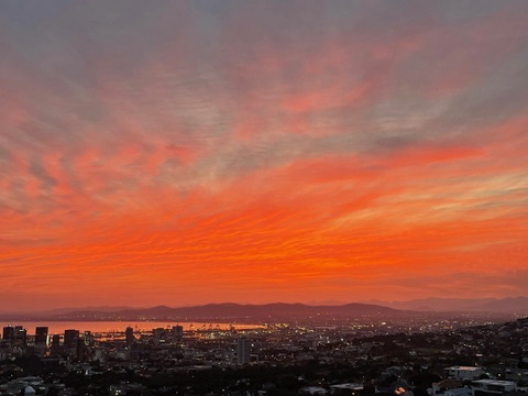 Cape Town bay and skyline under a burning red sunset sky